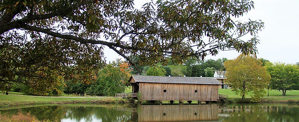 Alamuchee-Bellamy Covered Bridge over a pond in Livingston, Sumter County, Alabama