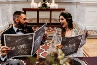 Tattooed Bride and Groom with Celestial themed Wedding Newspapers