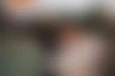 Manchester wedding couple with cool suit and dress in a car park with smoke bombs