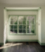 Residential interior design - master bedroom nook featuring sage green window trim.