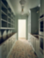 Residential interior design - green, galley scullery with herringbone brick floors.