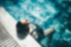Woman relaxing in the swimming pool..jpg
