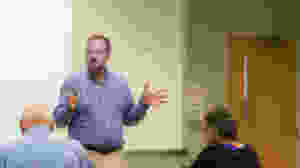 Eric Sheridan Wyatt, teaching a writing or literature class for adult learners.