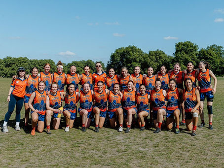 Wandsworth Demons Football Club in a team photo with their new Indigenous Round guernsey