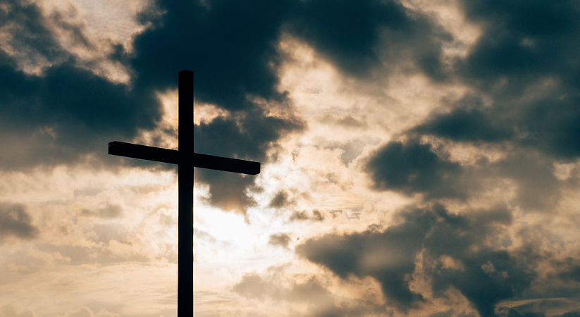 silhouette of cross under cloudy sky_edited.jpg