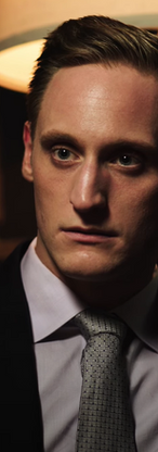 Nathaniel Dolquist suit scene Sunita Deshpande