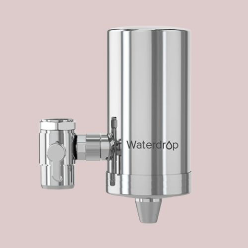Waterdrop stainless steel on-tap water filter attached to a kitchen tap with cylindrical metal housing