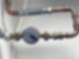 A Fernox magnetic scale reducer installed on an incoming water mains supply pipe