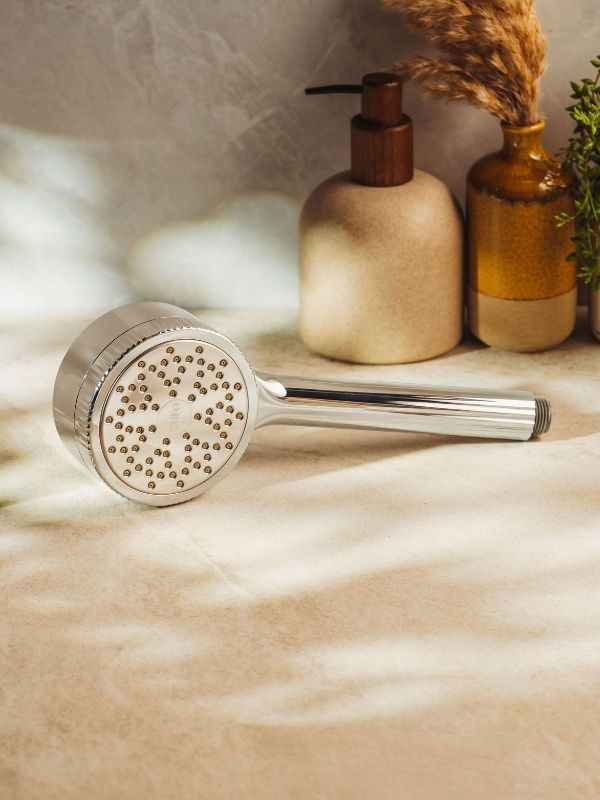 chrome curo skin shower filter on bathroom surface