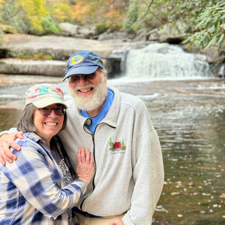 Blog Authors in front of a Waterfall near Gorges State Park
