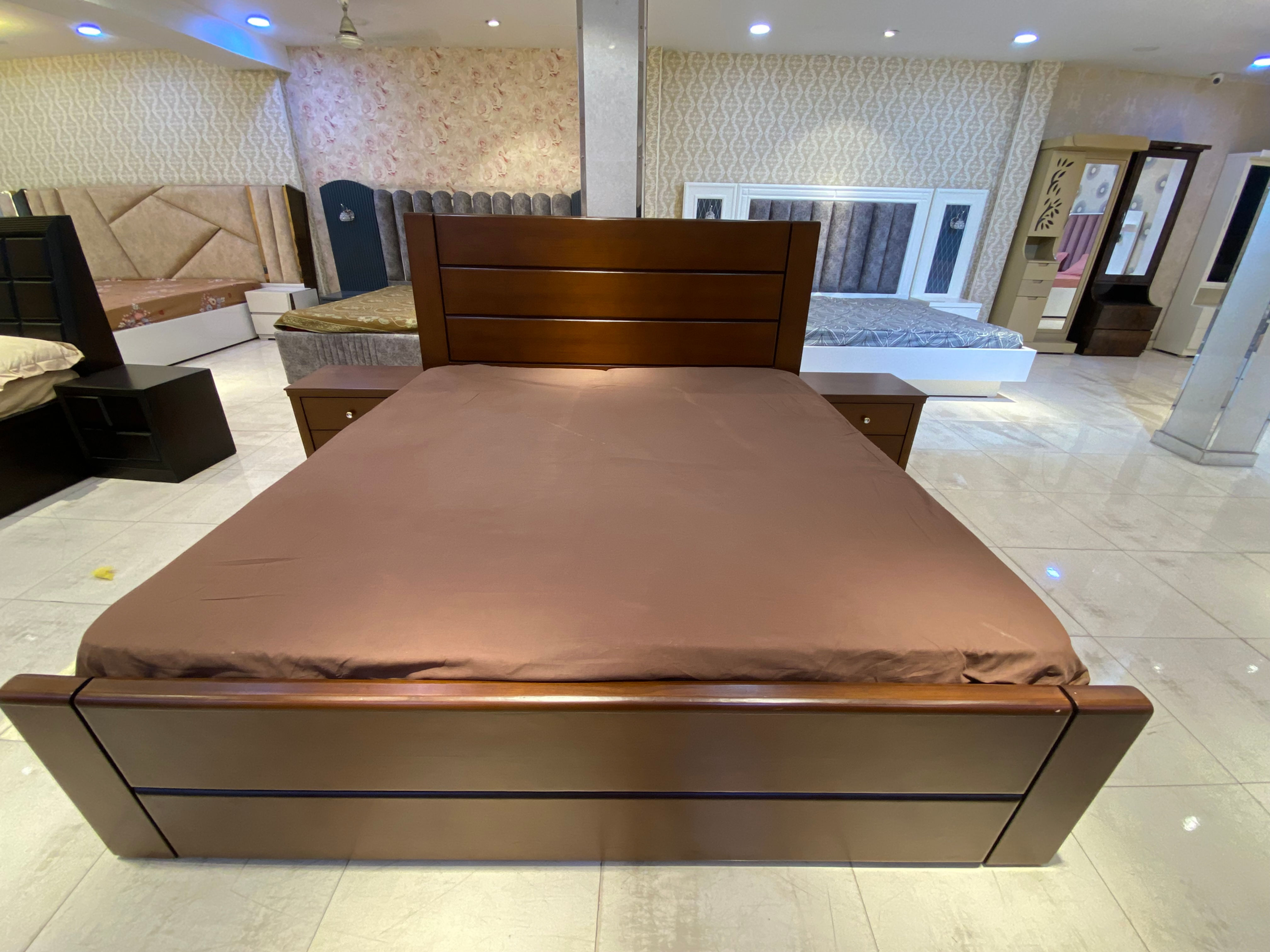 Brown bed in matt finish with simple grooves.