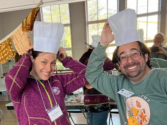 Chloe Rickards and volunteer with mushroom caps at the 51st Santa Cruz Fungus Fair. Photo by Hugh Smith