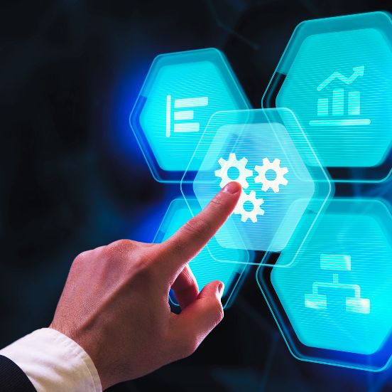A hand interacting with glowing digital icons representing automation and business processes.