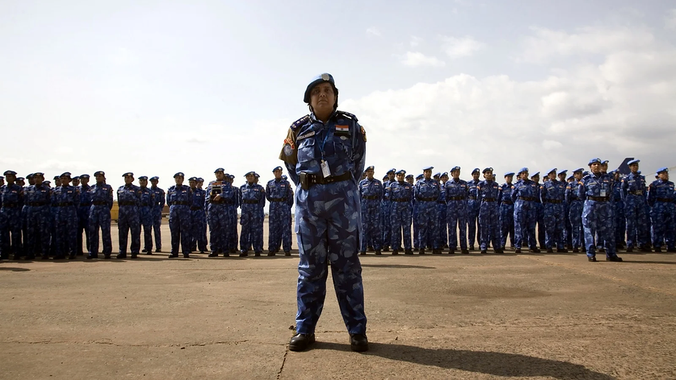 An Indian officer from the first all-female unit of United Nations peacekeepers stands in front of troops as they arrive at Roberts International Airport outside Liberia's capital Monrovia January 30, 2007. (Christopher Herwig/Reuters)