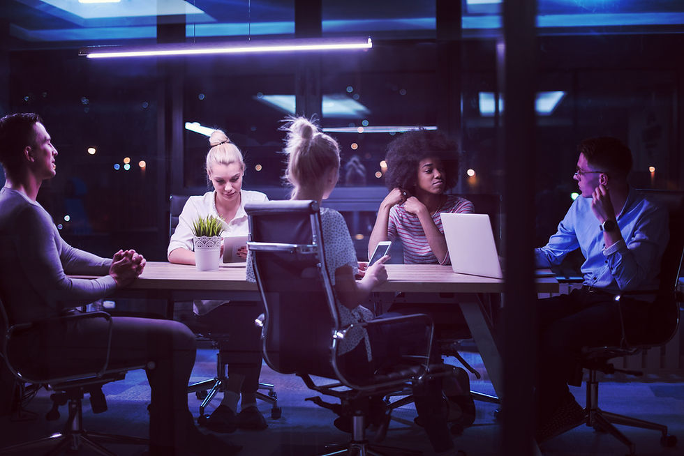 Team meeting late at night, collaborating on project