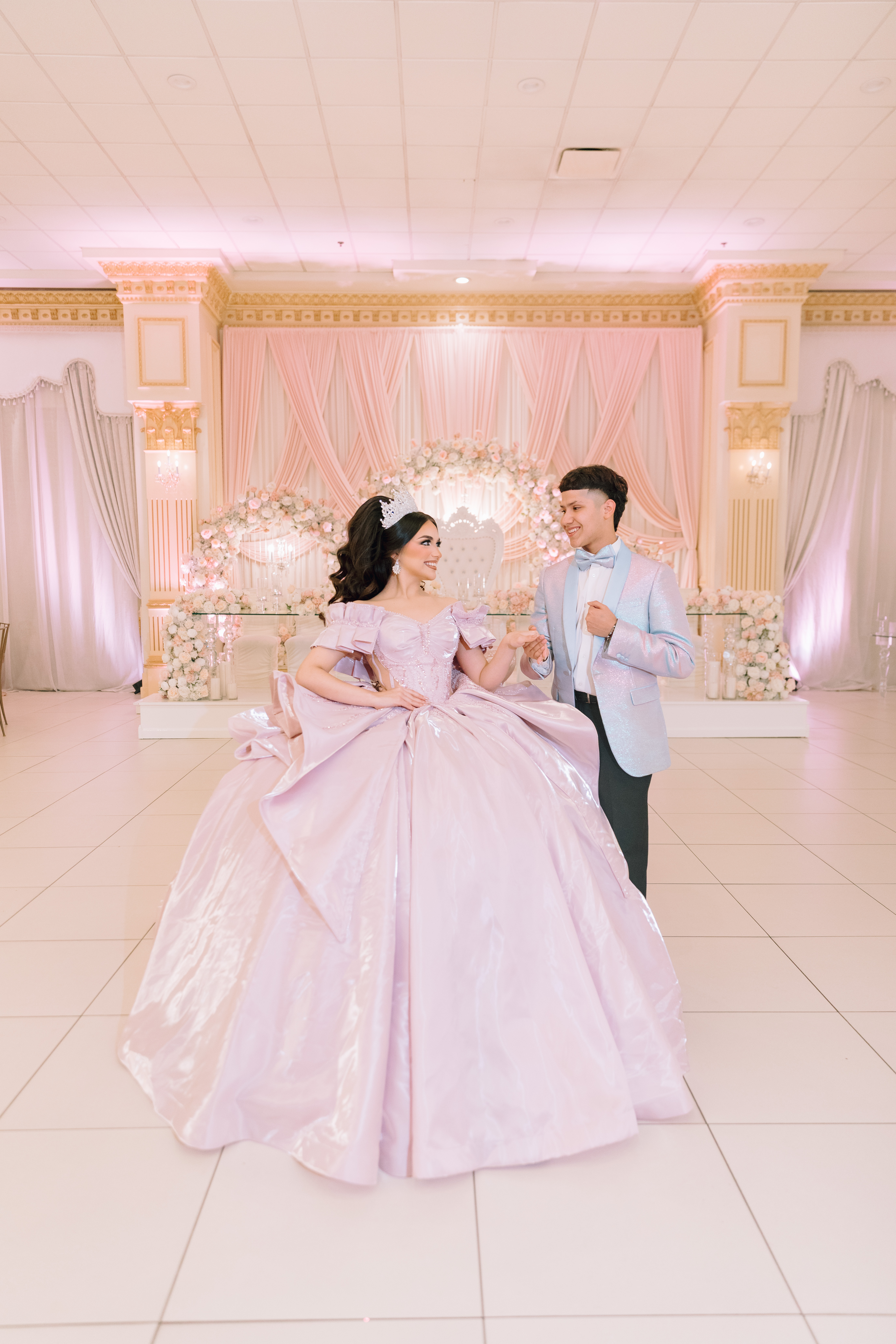 Mid-range Dallas wedding venue interior with decorated reception tables and warm lighting