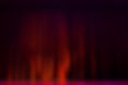 Red velvet curtains with the lights of the show and the wood flooring parquet..jpg