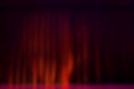 Red velvet curtains with the lights of the show and the wood flooring parquet..jpg