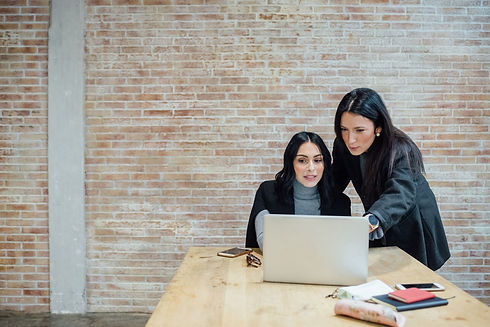 two-women-with-laptop-at-a-table.jpg