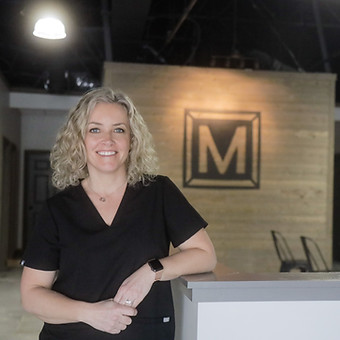 PTC Chiropractic Office Coordinator Bridget Koosemann in Dr. Bryan Hammer's Office