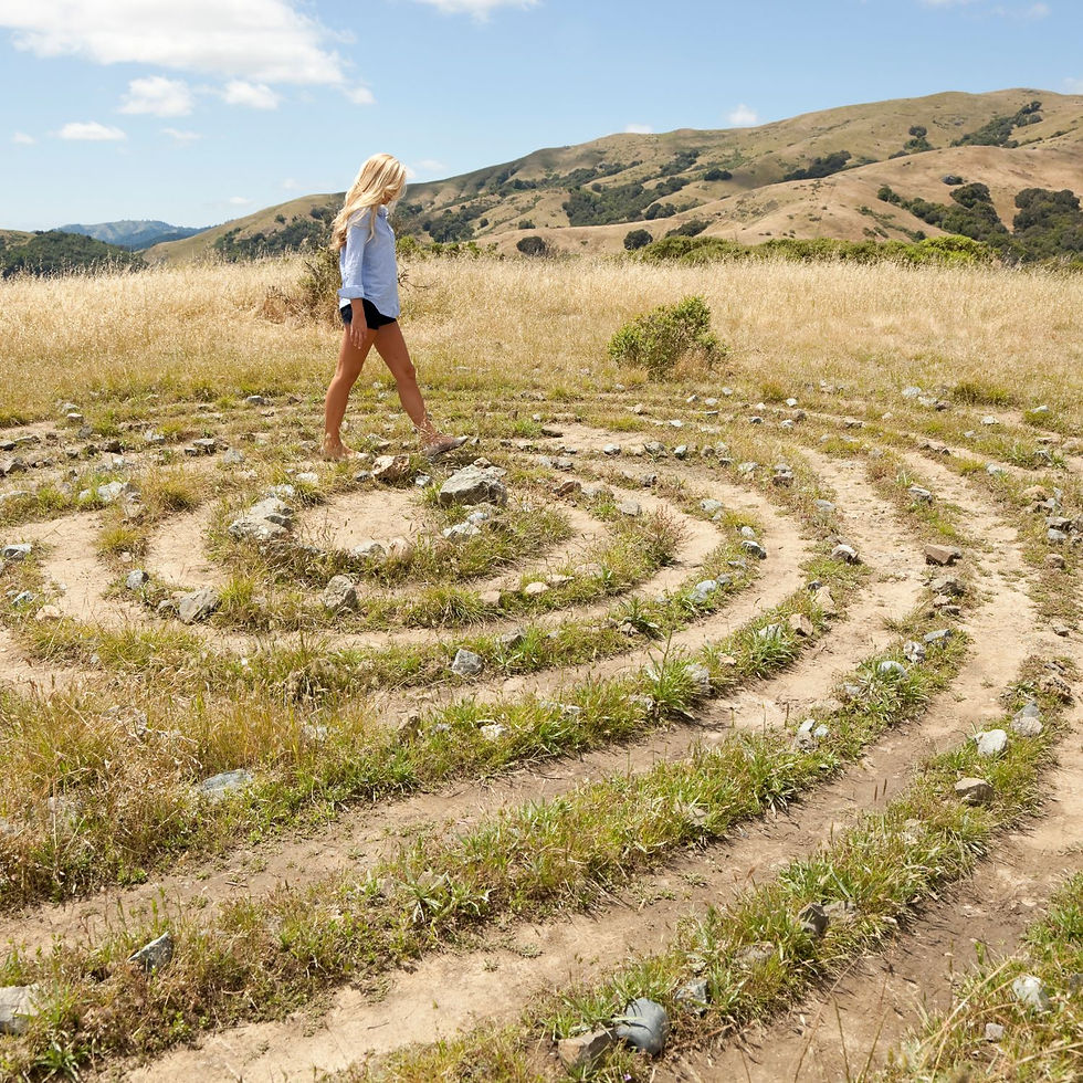 Woman working at a desk, surrounded by a "content maze," seeking clarity and purpose in her online business, reflecting the need to align with her God given purpose.