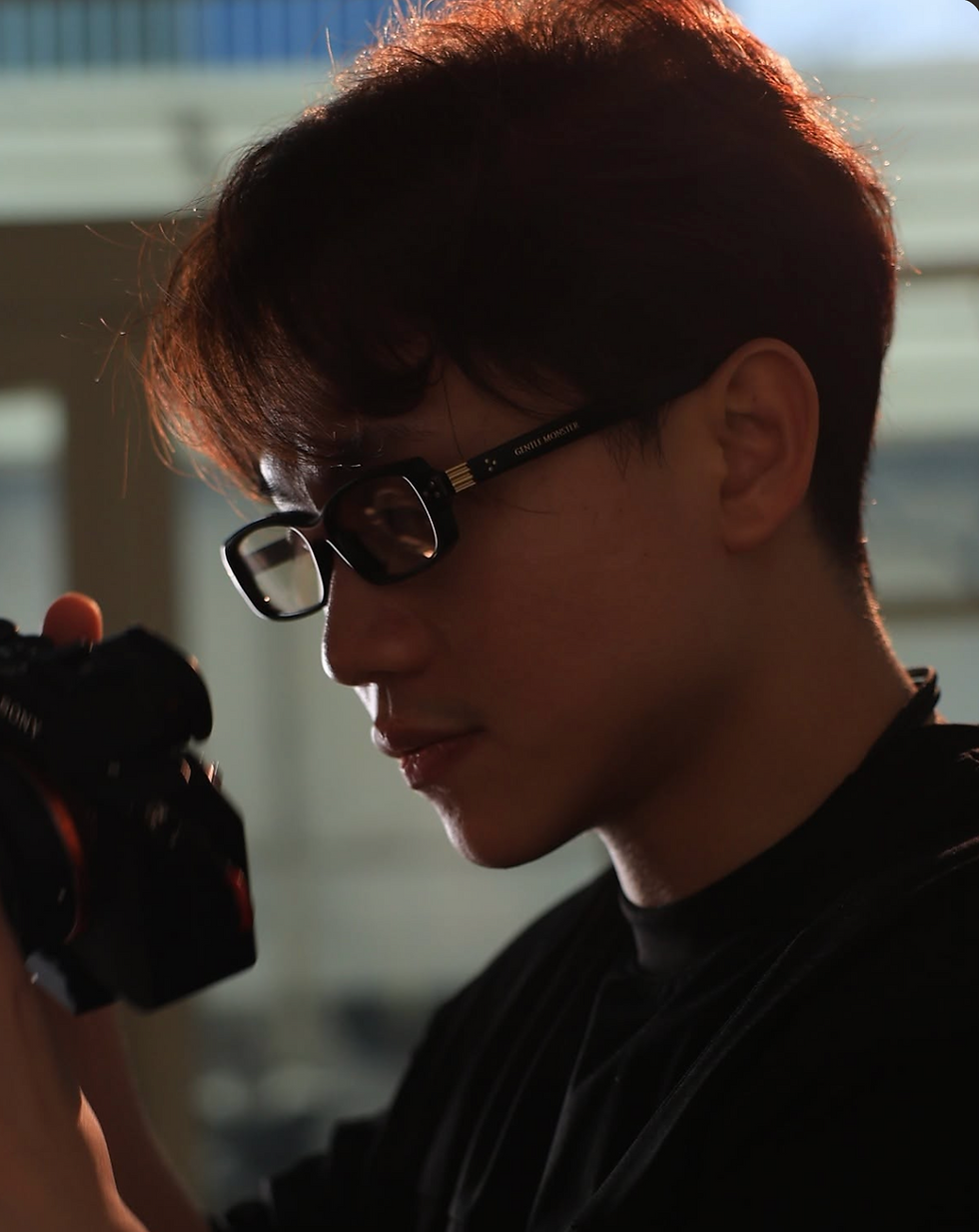 Tokyo Photographer & Videographer holding a camera