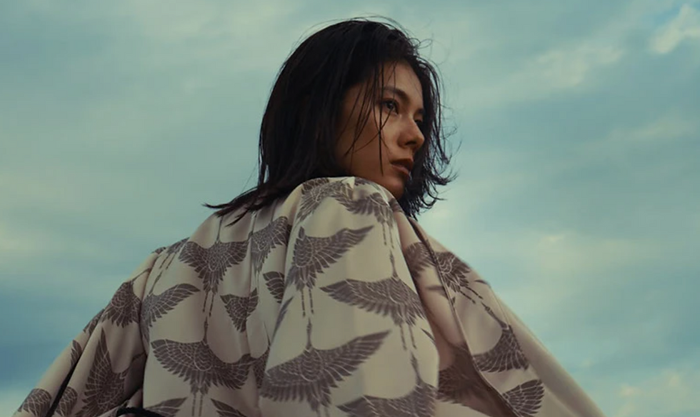 Woman in crane-pattern kimono by a Tokyo photographer