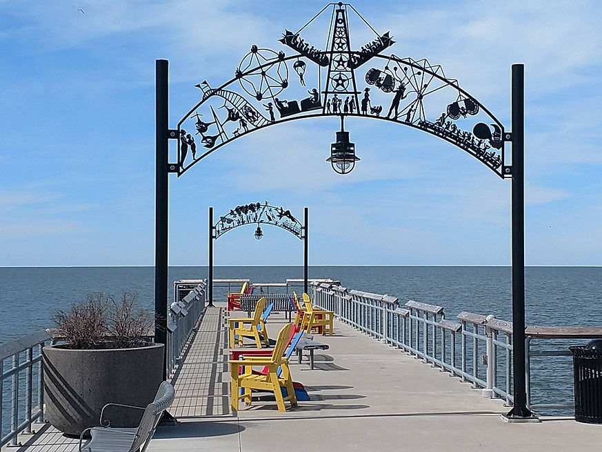 Archway over boarwalk, chairs on boardwalk, Euclid Beach