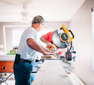 man standing infront of miter saw_edited