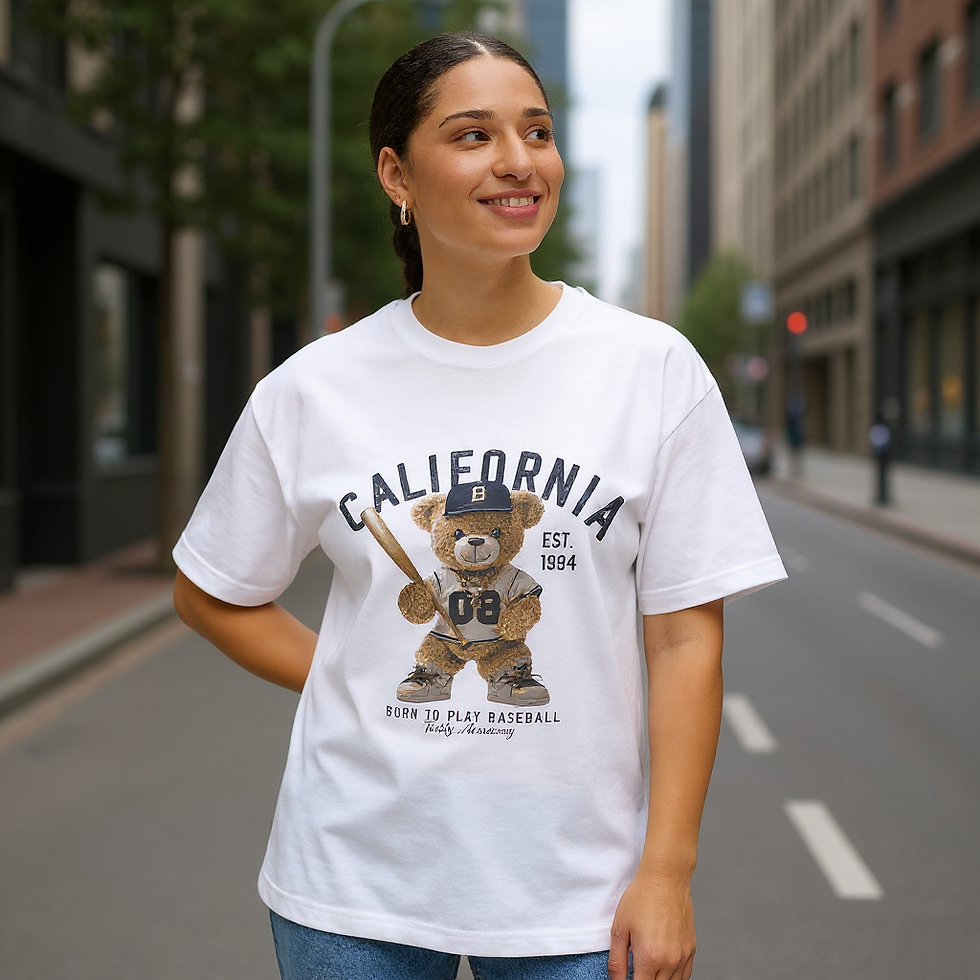 Urban Apparel California Baseball Bear Tee on a woman, oversized boxy white t-shirt with bear mascot, California text, and baseball gear illustration.