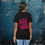 Thumbnail: White running t-shirt with pink "Just Keep Moving Forward" text and running silhouette, motivational fitness tee with brush-stroke lettering on woman.