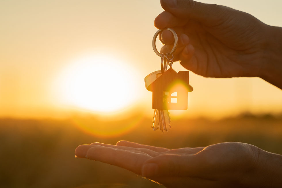 buying-renting-residential-house-concept-womans-hand-holds-key-with-keychain-shape-o.jpg