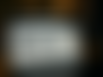 Ultra-realistic image of a laptop displaying Amazon’s machine learning-based sales recommendations, featuring products like a backpack, wireless earbuds, headphones, and the book Atomic Habits, with a silhouetted figure in the background.