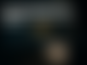 Ultra realistic image showing regression models used for predicting monthly sales volume, featuring a computer screen with sales graphs, bar charts, and statistical data, alongside a sales report document. A silhouetted figure is observing the data, representing data-driven sales forecasting with machine learning.