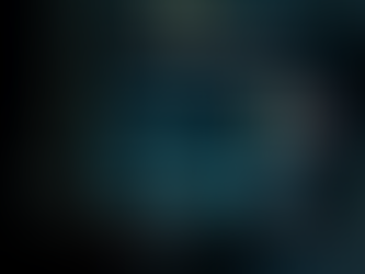 Ultra-realistic image showing a computer monitor displaying a voice analytics dashboard with speech analysis waveform, sentiment analysis pie charts, talk-to-listen ratio graphs, and sentiment trends over time. A silhouetted person observes the screen in a modern office setting, ideal visual for topics like voice analytics in sales conversations, sales performance AI, or call intelligence software.