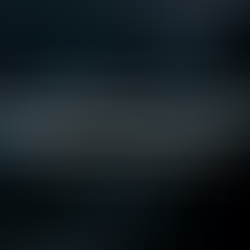 Silhouetted data scientist tuning machine learning hyperparameters on multi-monitor dashboard.