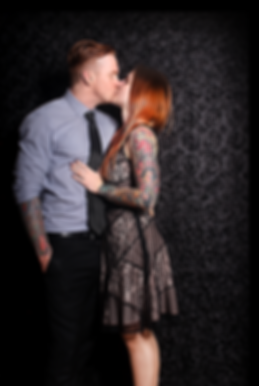 Couple Kissing in Photo Booth