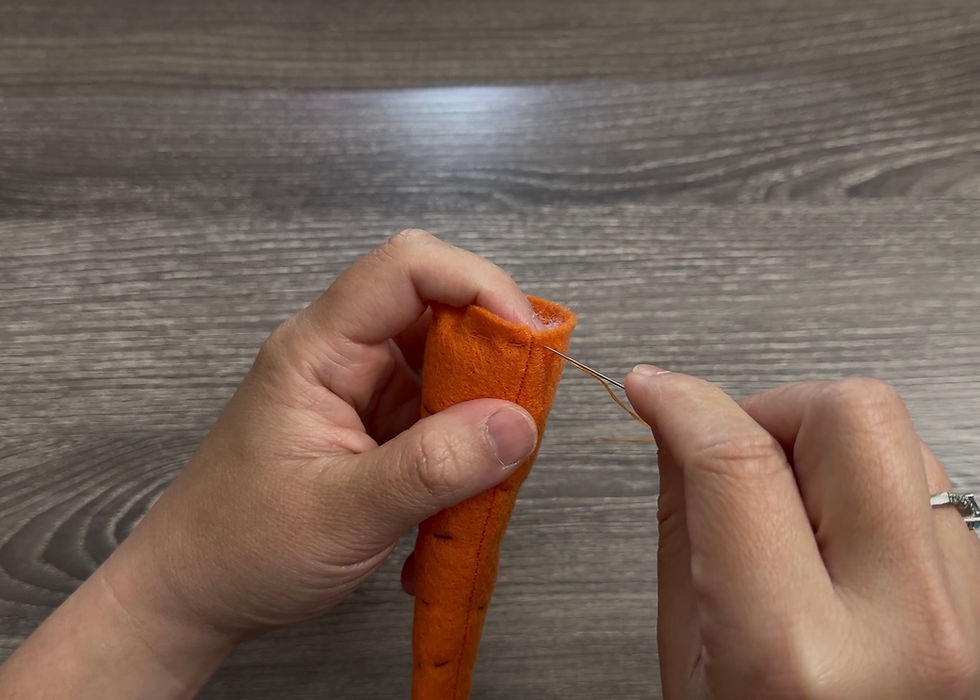 Sew a running stitch around the top opening of the carrot.