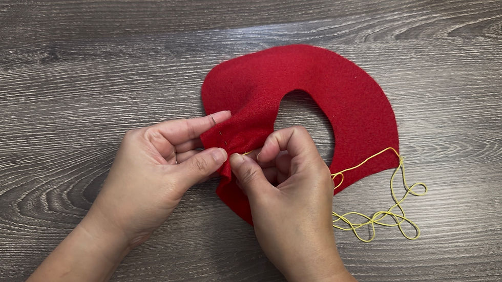 Using yellow thread, sew small running stitches over the seed markings on the Strawberry Front.