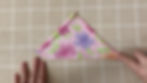 Press and fold the edges of the bandanna.
