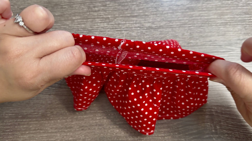 Gently stretch the waistband several times to pull the elastic into the casing and evenly distribute the gathers around the waist.