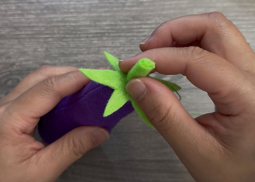 Put the green calyx eggplant topper On op of the eggplant..