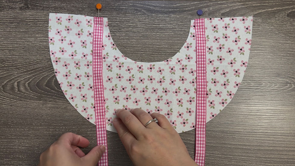 Place one ribbon at each front corner Pin or clip the ribbons in place.