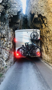 RV squeezing through roadway tunnel