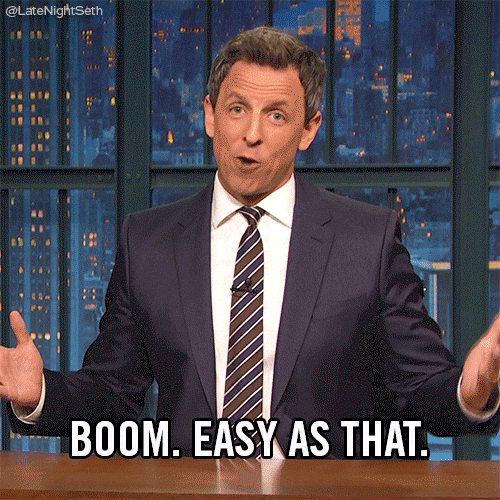 Man in suit gestures confidently on TV set with cityscape backdrop. Text reads "BOOM. EASY AS THAT." Mood is assured and casual.