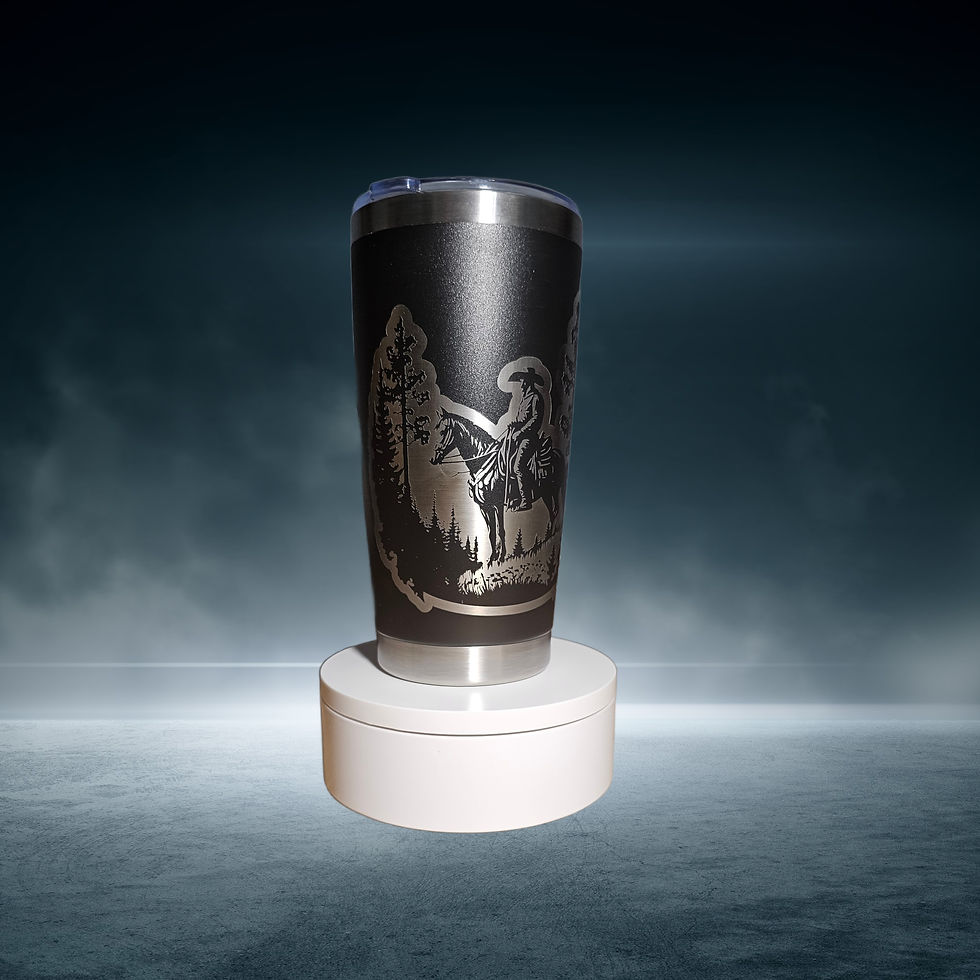 Thumbnail: 20oz tumbler laser engraved with a cowboy in a forest scene