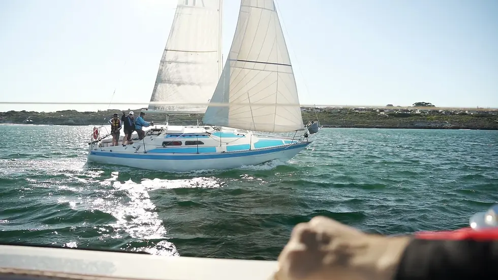 Two sailboats on the water