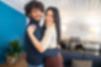 Happy young couple embracing at home after buying their first house in Adelaide