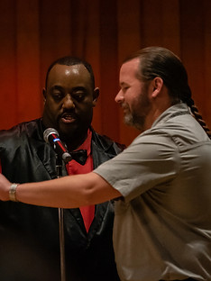 Dewayne Hill engaging with a customer during a live event.
