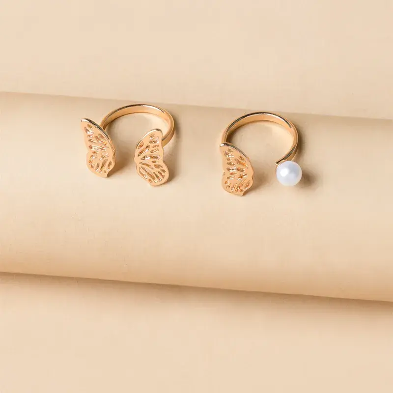 Thumbnail: Set de dos anillos ajustables mariposas y perlita